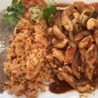 Pollo A La Diabla · Prepared with special hot sauce, mushrooms, and onions served with rice and beans.