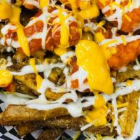 Buffalo Fries · Crispy fries topped with breaded boneless chicken pieces smothered in buffalo sauce, queso, ...