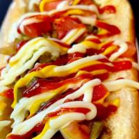 Sonora Dog · Beef dog wrapped in bacon topped with grilled onions, tomatoes, beans, mayo, ketchup and jal...