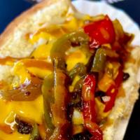 Philly Dog · Beef dog wrapped in bacon topped with queso, chipotle sauce, grilled peppers, mushrooms and ...