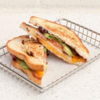Three Cheese Grilled Cheese · Swiss, Cheddar, and Pepper Jack on Cranberry White Bread with Spring Mix, Tomatoes, Avocado,...