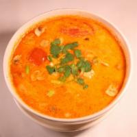 Tom Kha · Creamy coconut milk soup with traditional thai herb and spices, mushroom, onions, tomatoes, ...