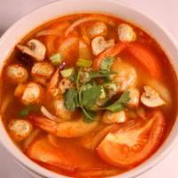 Tom Yum Soup · Thai traditional spicy and sour soup, mushroom, onions, tomatoes, lemon grass, Thai chili, a...