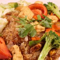 Phad Woon Sen · Glass noodle with egg, onion, cabbage, carrot, tomato, celery, and broccoli. Served with you...