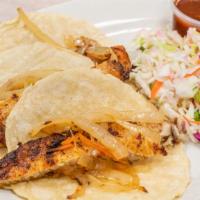 Fish Tacos (3) · Fried non breaded tilapia served on corn tortilla with caramelized onions and carrots, side ...