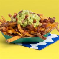 Bacon Guac Fries · French fries topped with guacamole, bacon bits and shredded cheese.