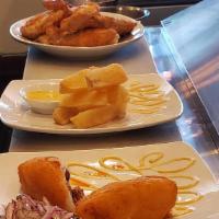 Yuquitas Doradas · Boiled cassava root fried to golden perfection. Served with Peruvian sauces.