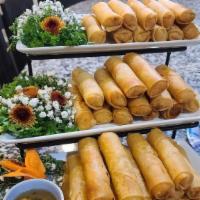 Crispy Spring Rolls · Mashed seasoned sweet potato spread on spring roll paper with carrots, cabbage, and tofu (2p...