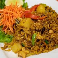 Pineapple Fried Rice · Fried rice with egg, pineapple, cashews, raisins, bell peppers, and onions with your choice ...