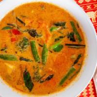 Panang Curry · Curry with coconut milk, bell peppers, lime leaves, green beans, carrots, and choice of prot...