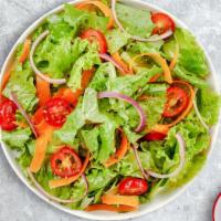 Mixed Greens Salad · Romaine lettuce, cherry tomatoes, carrots, and onions dressed tossed with lemon juice & oliv...