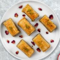 Baby Baklava · A rich, sweet dessert pastry made of layers of filo filled with chopped nuts and covered in ...