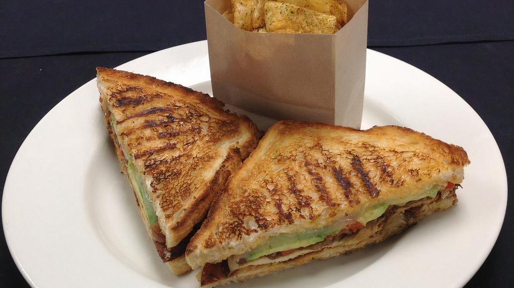 Santa Fe Chicken Panini · blackened chicken, jack cheese, roasted red peppers, caramelized onion, avocado, chili pepper aïoli, crisp country bread. 1050 | 940 cal.
