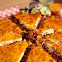 Triple Decker- Pizzadilla · 3 Extra Humongous Flour tortillas filled with boat loads of mozzarella cheese, filled with y...