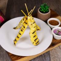 Satay Chicken · Gluten free. Four pieces. Marinated tender chicken skewers. Served with cucumber and peanut ...