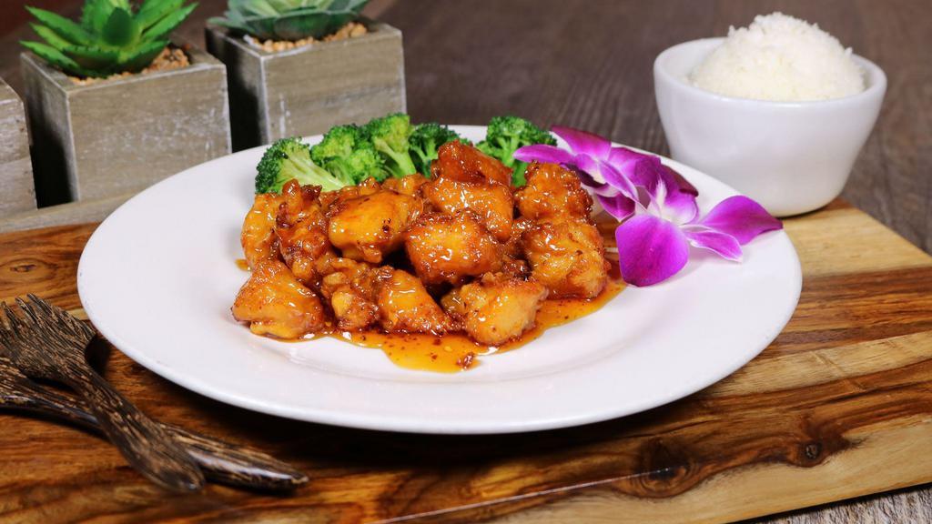 Orange Chicken · Breaded chicken tried and mixed with orange sauce. Served with steamed broccoli. Served with steamed Thai jasmine rice.