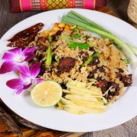 Thai Sausage Fried Rice · Thai jasmine rice sauteed with Thai style sausage, egg, green onion and topped with fresh gi...