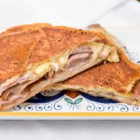 Miami Cuban Sandwich (The 305) · Smoked ham, roasted pork, Swiss cheese, pickles, homemade mustard sauce, and Cuban bread.