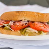 Torta Regular · White bread with mayo, guacamole, lettuce, tomatoes, onion, jalapeño and choice of meat.
