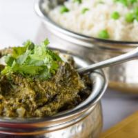 Saag Paneer · Spinach cooked with homemade soft cheese, onions, garlic, cream and spices.