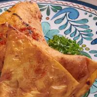 Vegetable Samosa · Two deep fried pastry stuffed with vegetables.