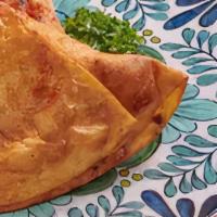 Paneer Samosa · Deep fried pastry stuffed with vegetables and homemade cheese.