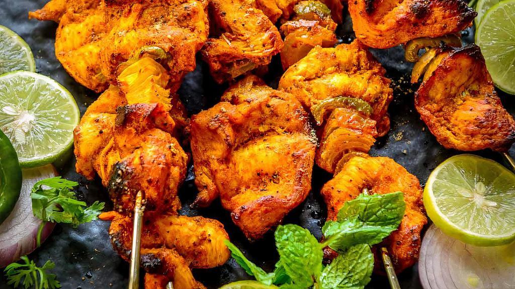 Chicken Tikka (Full) · Marinated chicken tenders flavored with herbs and spices, cooked in clay oven.