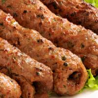Lamb Seekh Kebab · Tender lamb flavored with herbs and spices, cooked in the clay oven.