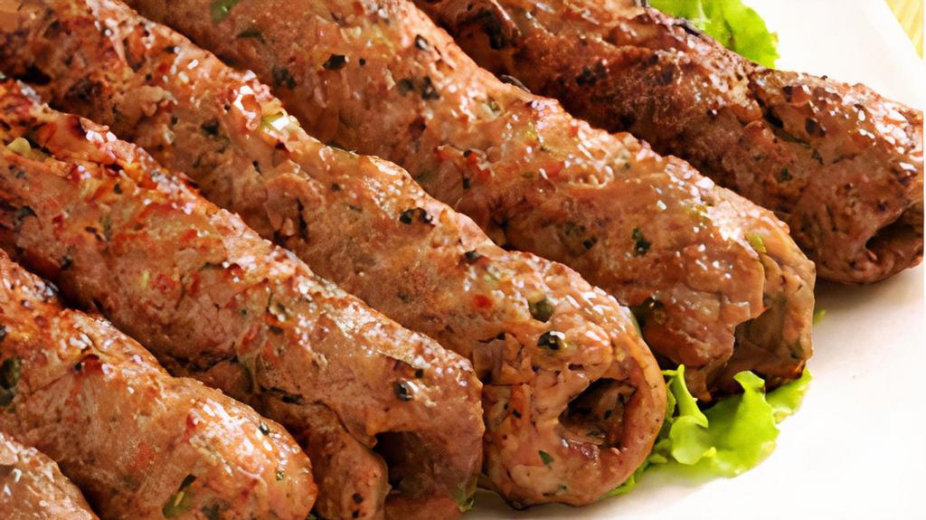 Lamb Seekh Kebab · Tender lamb flavored with herbs and spices, cooked in the clay oven.