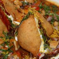 Samosa Chaat · Samosa chaat is made of a base of chana masala (chickpea curry) and samosa (savory fried pas...