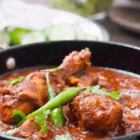 Chicken Vindaloo · Tender pieces of chicken cooked in hot Madras spices.