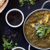 Saag Paneer · Homemade cheese cooked with spinach and spices.