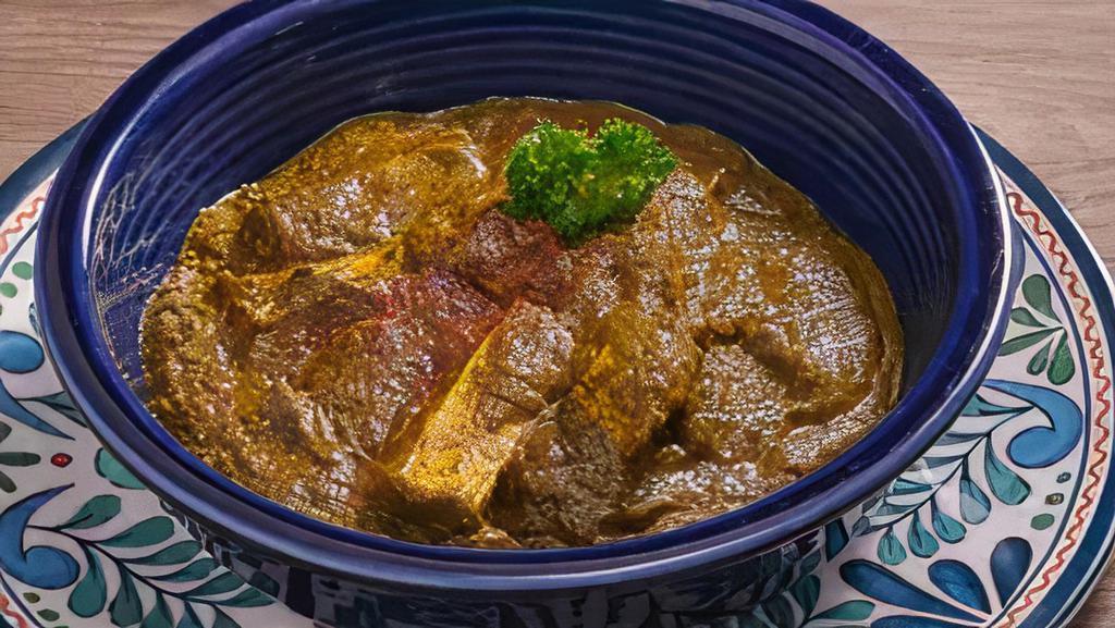 Lamb Saag · Tender pieces of lamb cooked with spinach and spices.