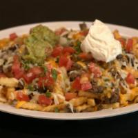 Carne Asada Fries · Fries with choice of meat, melted cheese, sour cream, guacamole, and topped with pico de gal...