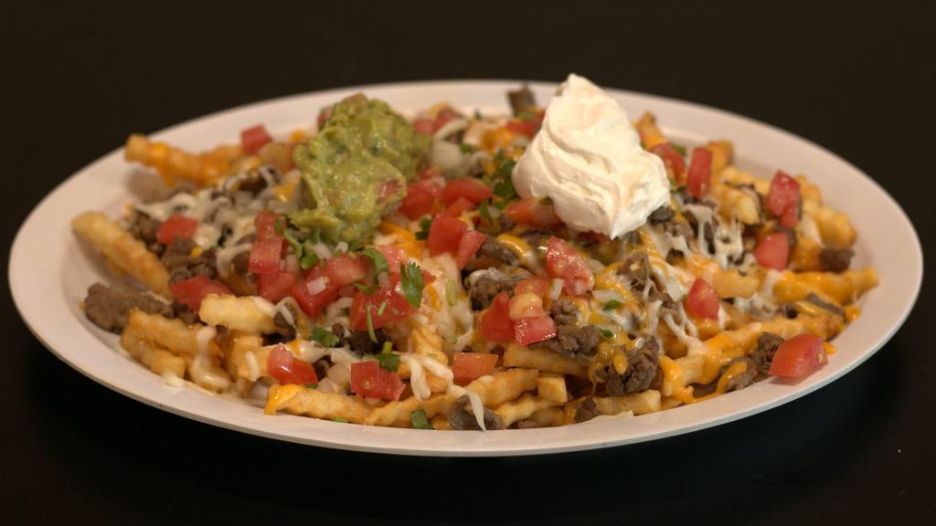 Carne Asada Fries · Fries with choice of meat, melted cheese, sour cream, guacamole, and topped with pico de gallo.