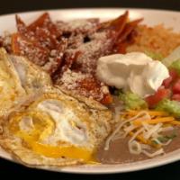 Chilaquiles · Served with rice and beans.
