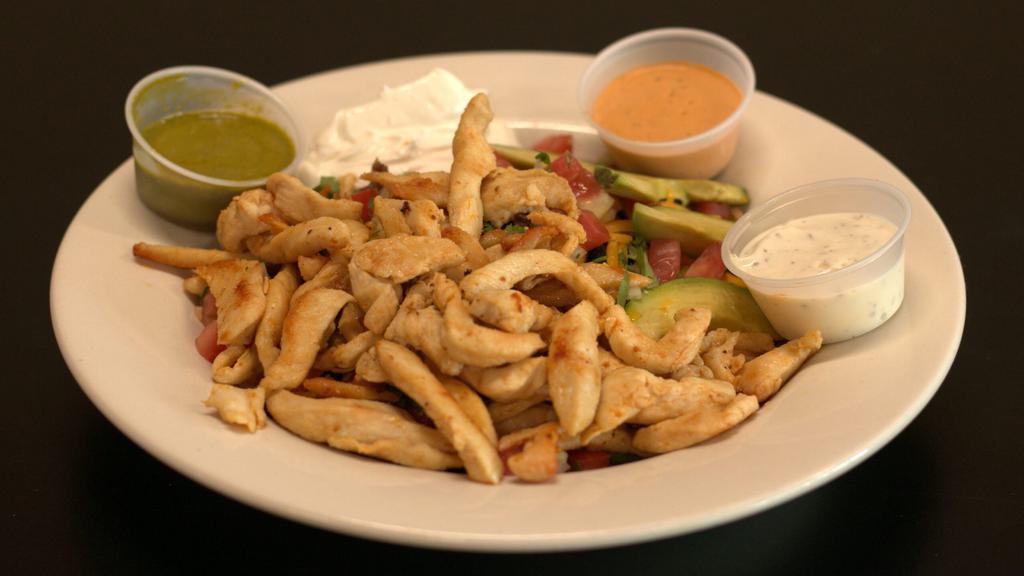 Grilled Chicken Salad · Boneless grilled chicken breast on a bed of lettuce, topped with tomatoes, onions, cheese, and avocado slices.