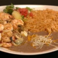 Camarones Al Mojo De Ajo · Prawns and mushrooms sautéed with butter, onions, garlic and spices. Served with rice, beans...