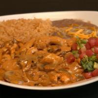 Camarones Al Chipotle · Prawns cooked with mushrooms and onions in our delicious chipotle sauce. Served with rice, b...