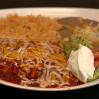 Enchiladas Plate · 2 soft tortilla filled with choice of meat, topped with melted cheese and enchilada sauce. S...