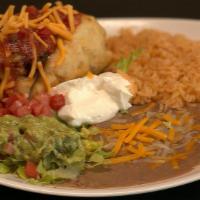 Chimichanga Plate · Deep fried flour tortilla with your choice of meat topped with cheese, lettuce, sour cream, ...