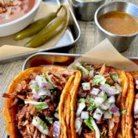 Birria Tacos · 3 Beef Birria Tacos topped with red onions and cilantro. Side of Consome, pickled Serranos, ...