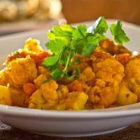 Aloo Gobi · Cauliflower and potatoes cooked in a dry mild spice blend.