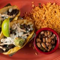 Main Street Tacos · Grilled steak, charro beans, and corn tortillas, topped with guacamole, house crema, cotija ...