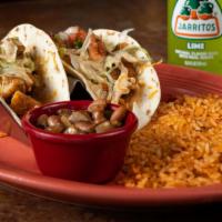 Chipotle Crispy Chicken Tacos · Crispy fried chicken over melted cheese on a flour tortilla, topped with chipotle ranch, pic...