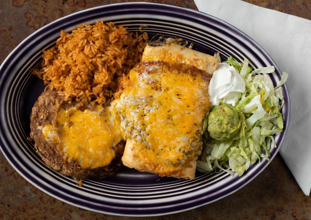 Chimichanga · Deep fried burrito, smothered in cheese and sauce. Served with guacamole, and sour cream.