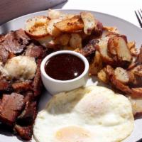 Smoked Brisket & Eggs · 10 oz of our signature 12 hour house smoked brisket, grilled to perfection & topped with cre...