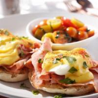 Traditional Bene · Grilled honey cured country ham atop an English muffin, topped with farm fresh poached eggs ...
