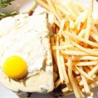Croque Madame · Rich and decadent breakfast sandwich made with bacon, brisket and cheese on toasted bread, s...