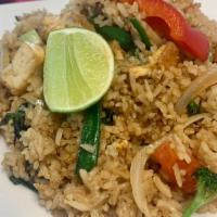 Vegan Basil Fried Rice · Stir-fried rice with green onion, yellow onion, Thai basil. Served with tofu.